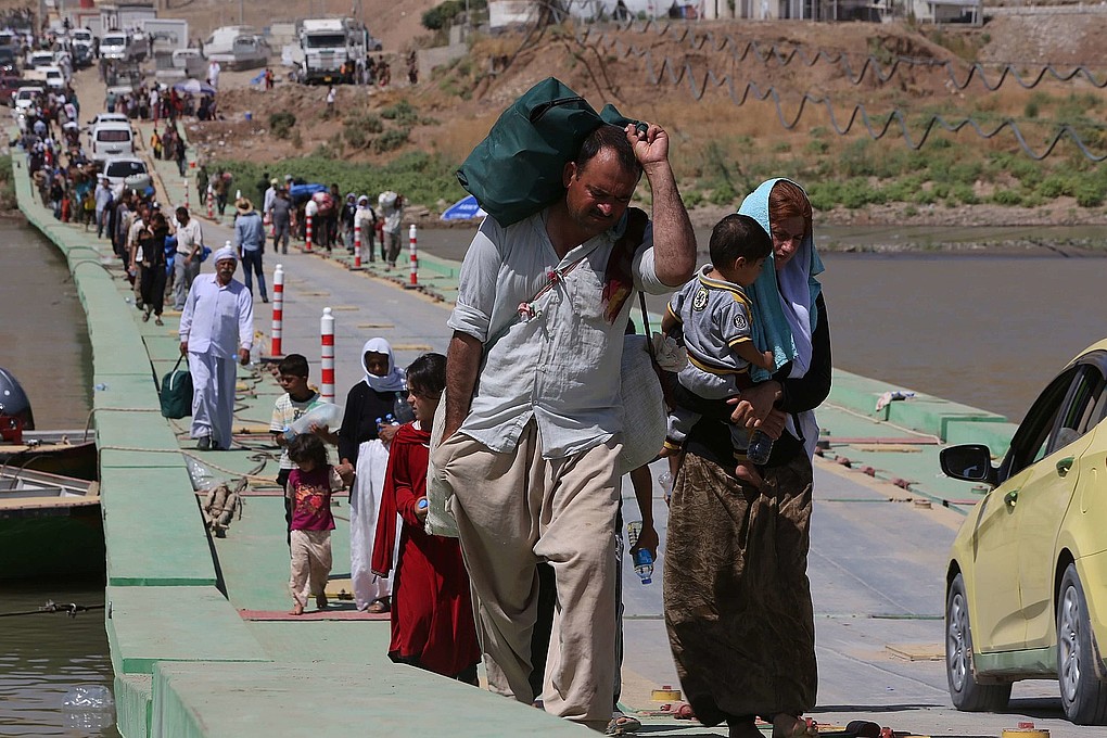 Personas yazidíes huyendo del Estado Islámico
